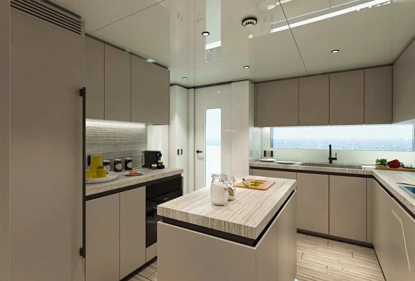 The modern galley features sleek cabinetry, a center island, and ample natural light. aboard AES Yacht for Sale