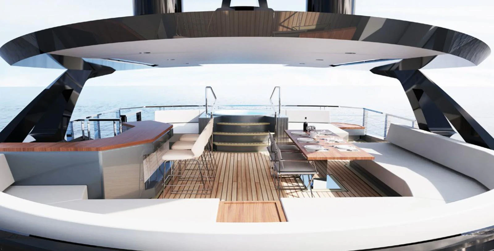 The yacht's aft deck features a luxurious seating area with a dining table and a jacuzzi, offering stunning ocean views. aboard AES 85 Yacht for Sale
