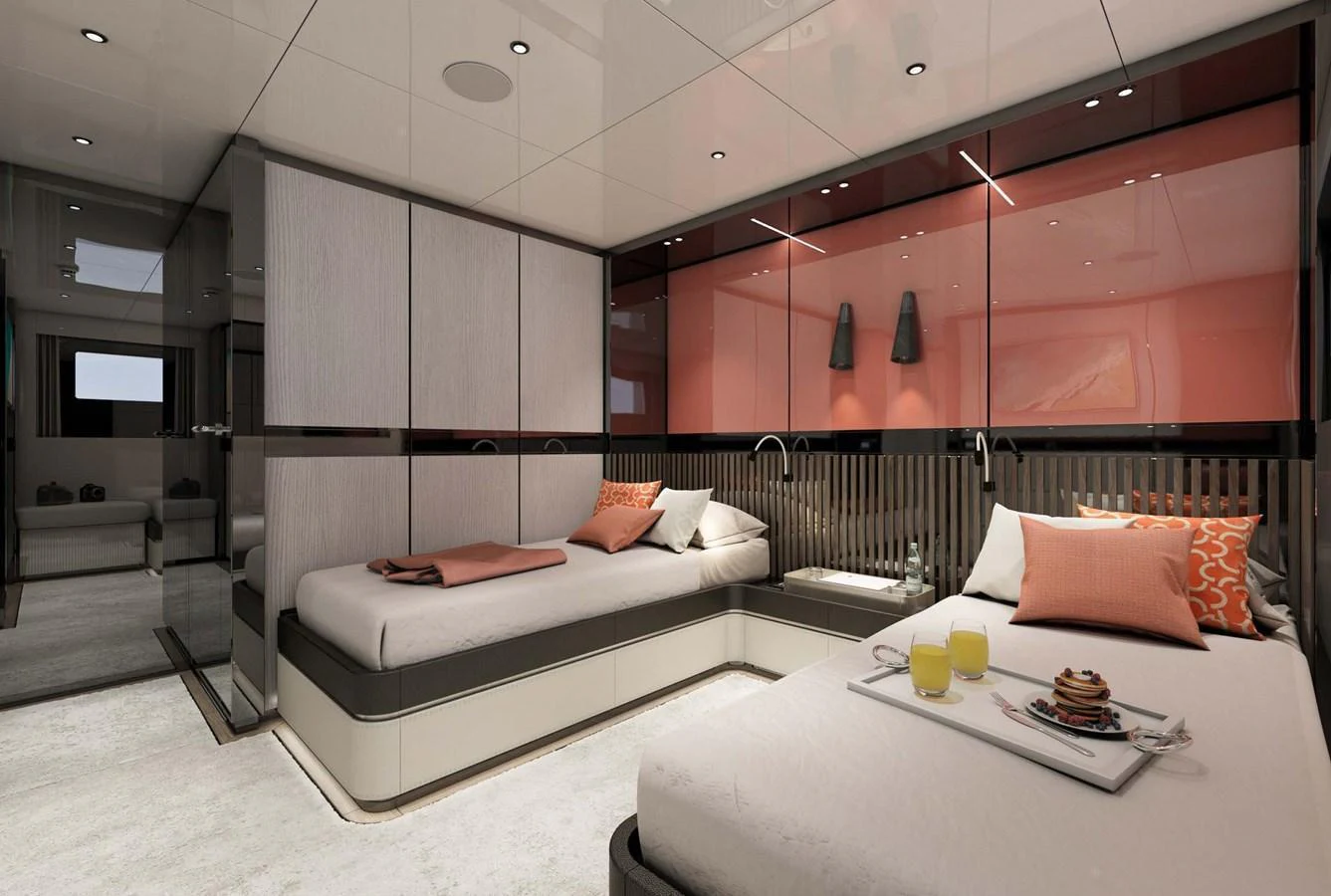The guest stateroom offers a modern and cozy retreat with twin beds and elegant decor. aboard AES 85 Yacht for Sale