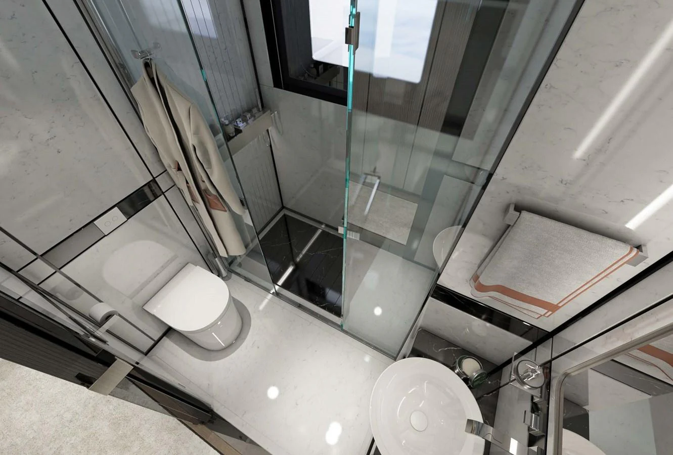 A modern yacht bathroom featuring sleek fixtures and a glass-enclosed shower. aboard AES 85 Yacht for Sale
