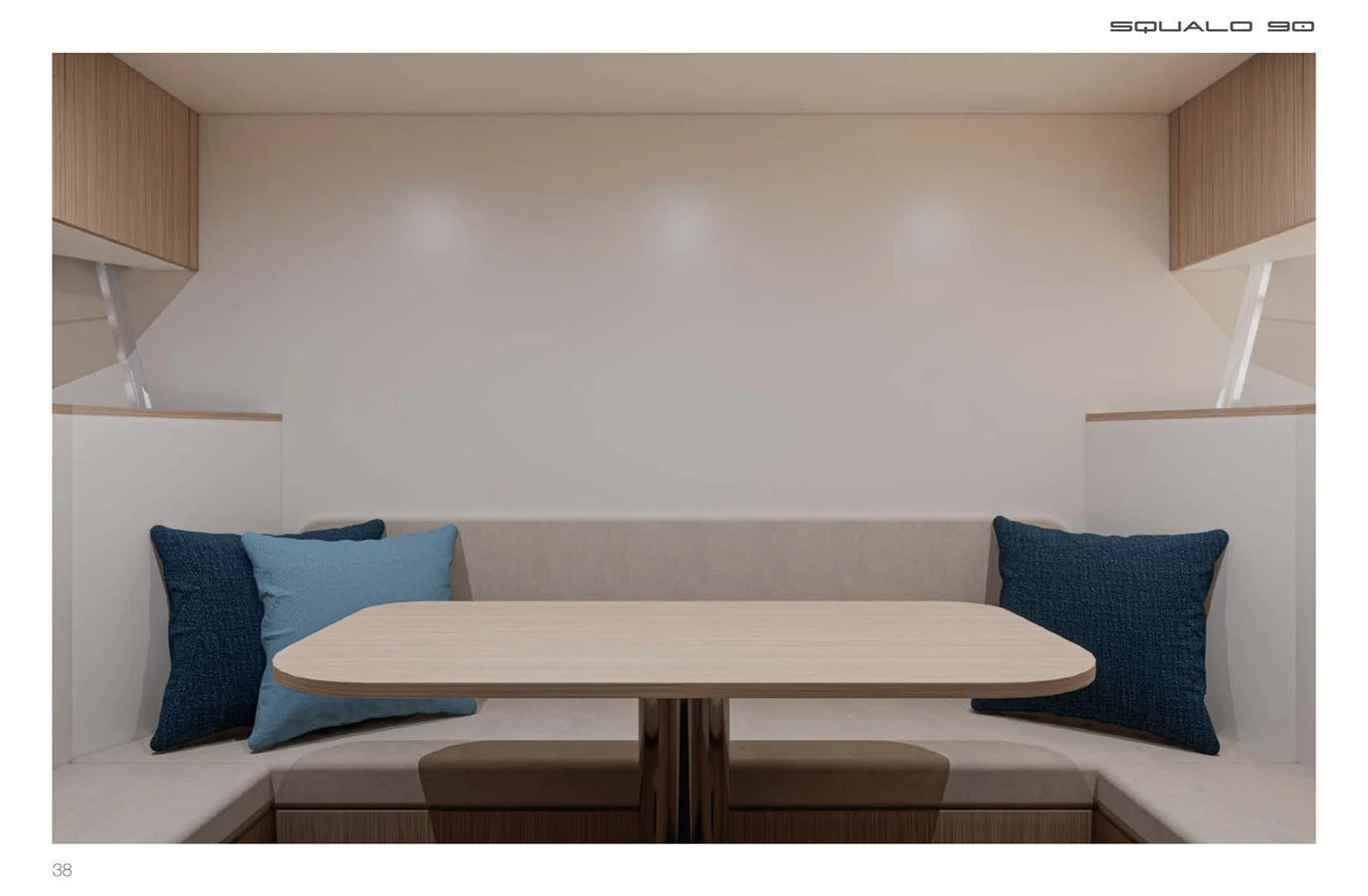 The yacht's dining area features a cozy seating arrangement with a wooden table and plush cushions. aboard SQUALO 90 Yacht for Sale