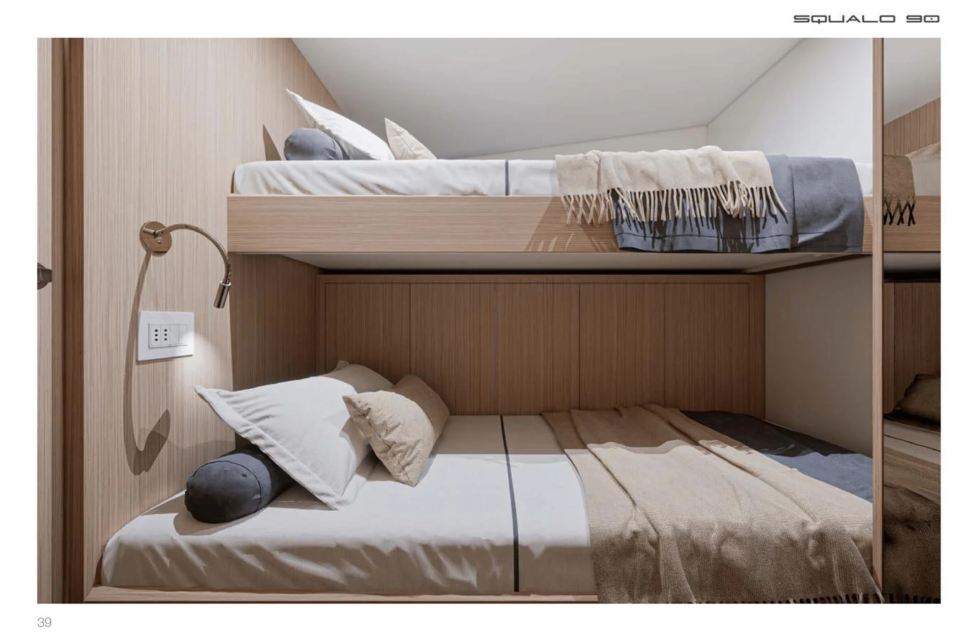 The cozy bunk cabin features comfortable bedding and modern lighting. aboard SQUALO 90 Yacht for Sale