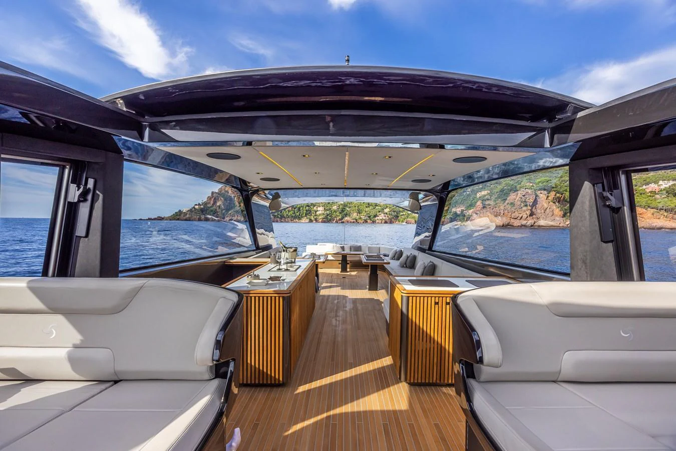 The yacht's salon offers a spacious and luxurious area with panoramic views of the surrounding waters. aboard SEXY ME Yacht for Sale