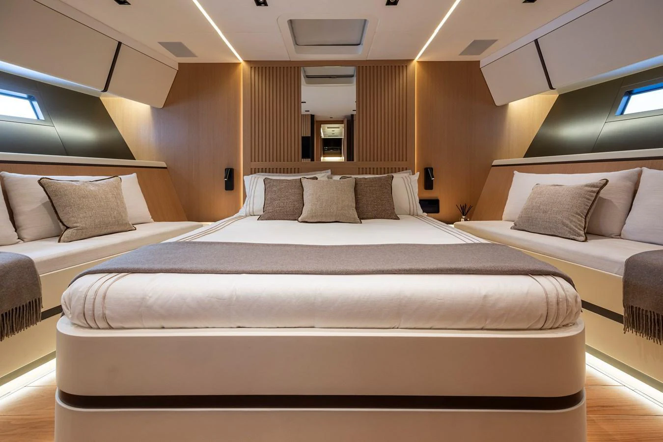 The master stateroom features a luxurious bed with elegant bedding and ample natural light. aboard SEXY ME Yacht for Sale