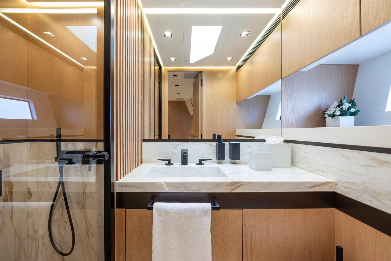 The yacht's bathroom features modern fixtures and elegant marble accents. aboard SEXY ME Yacht for Sale