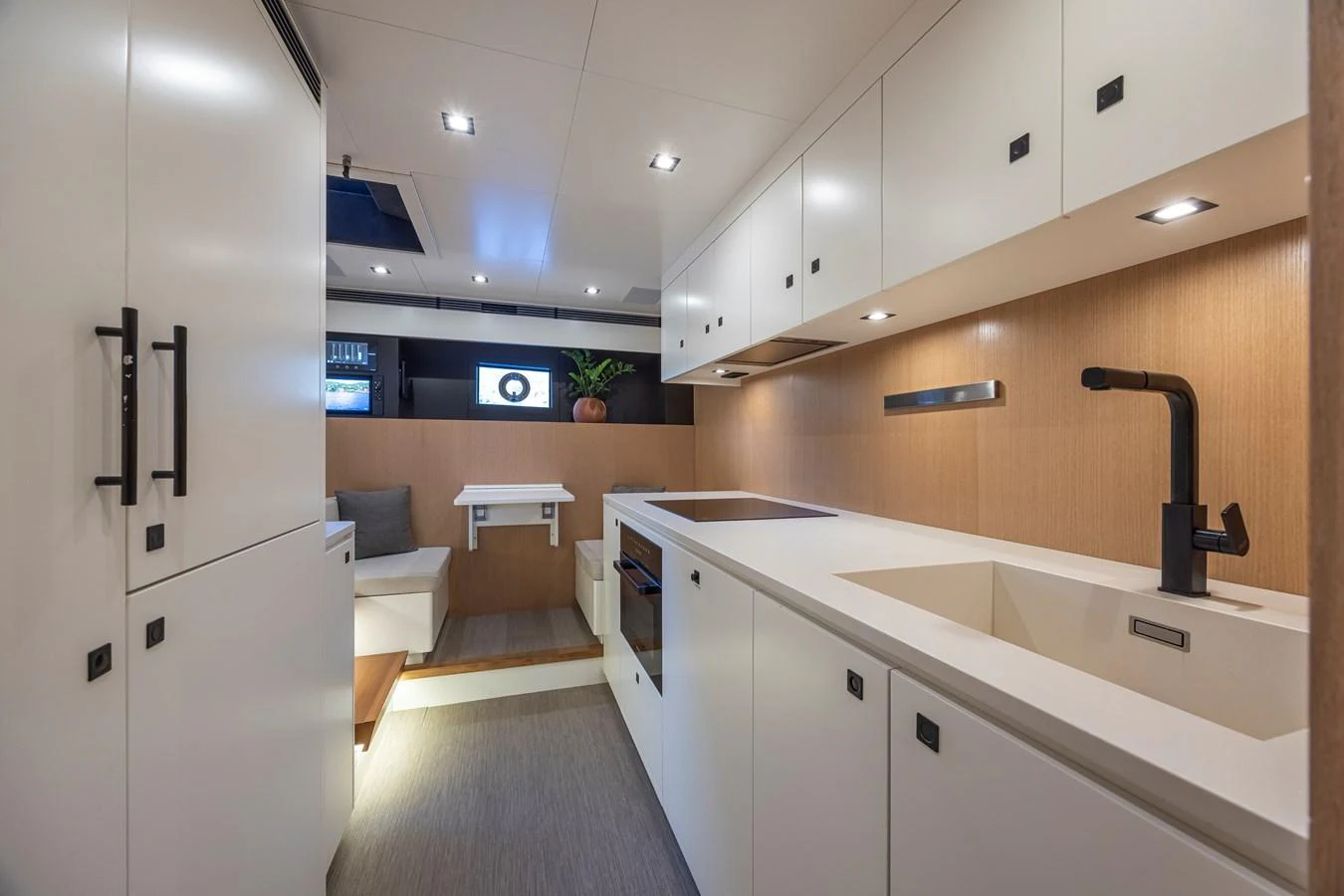 The modern galley features sleek cabinetry and high-end appliances, creating a functional and stylish space. aboard SEXY ME Yacht for Sale