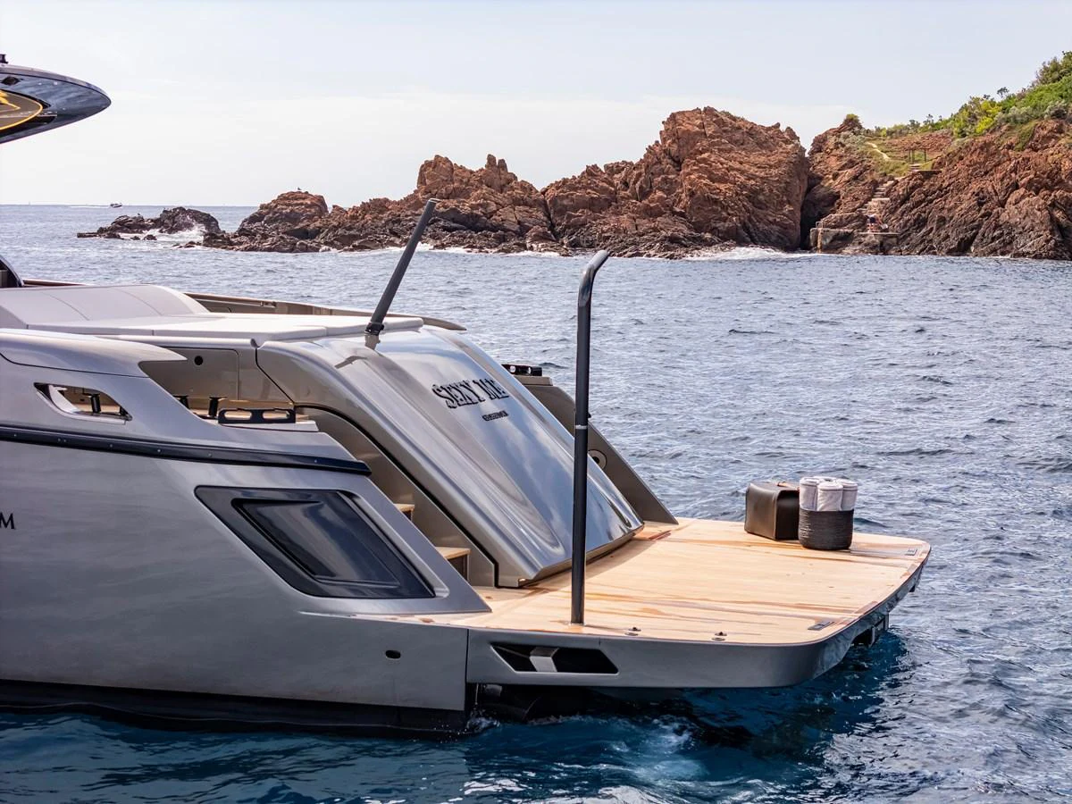 The yacht's sleek swim platform offers easy access to the water, perfect for leisure and relaxation. aboard SEXY ME Yacht for Sale