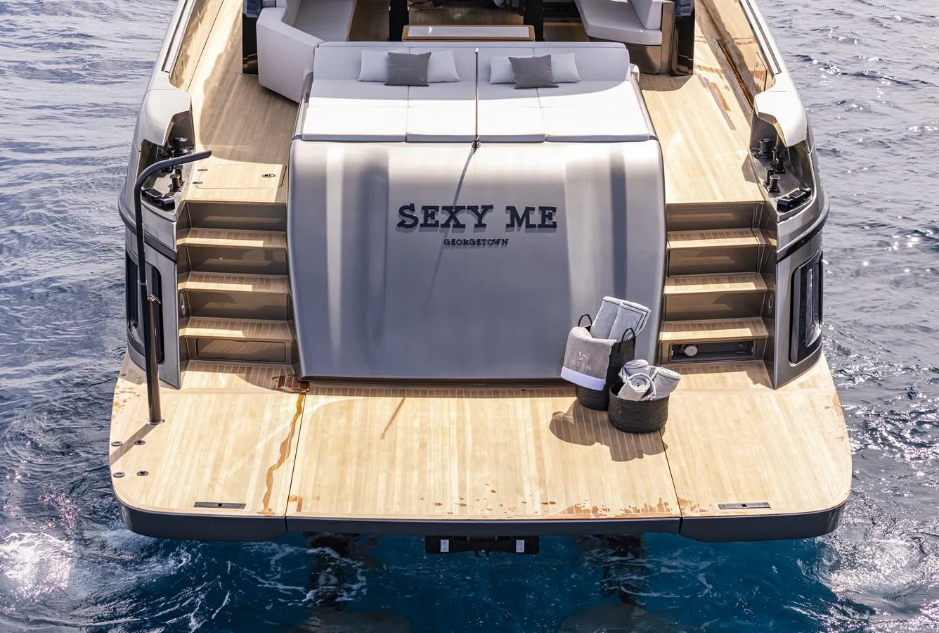 The yacht's aft deck features a spacious lounging area with comfortable seating and easy access to the water. aboard SEXY ME Yacht for Sale