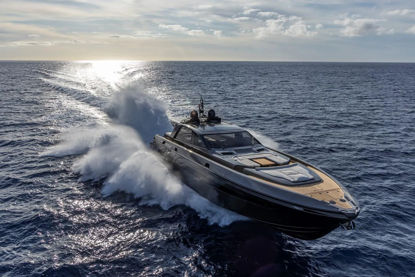 A sleek yacht cruises swiftly through open waters under a bright sky. aboard SEXY ME Yacht for Sale