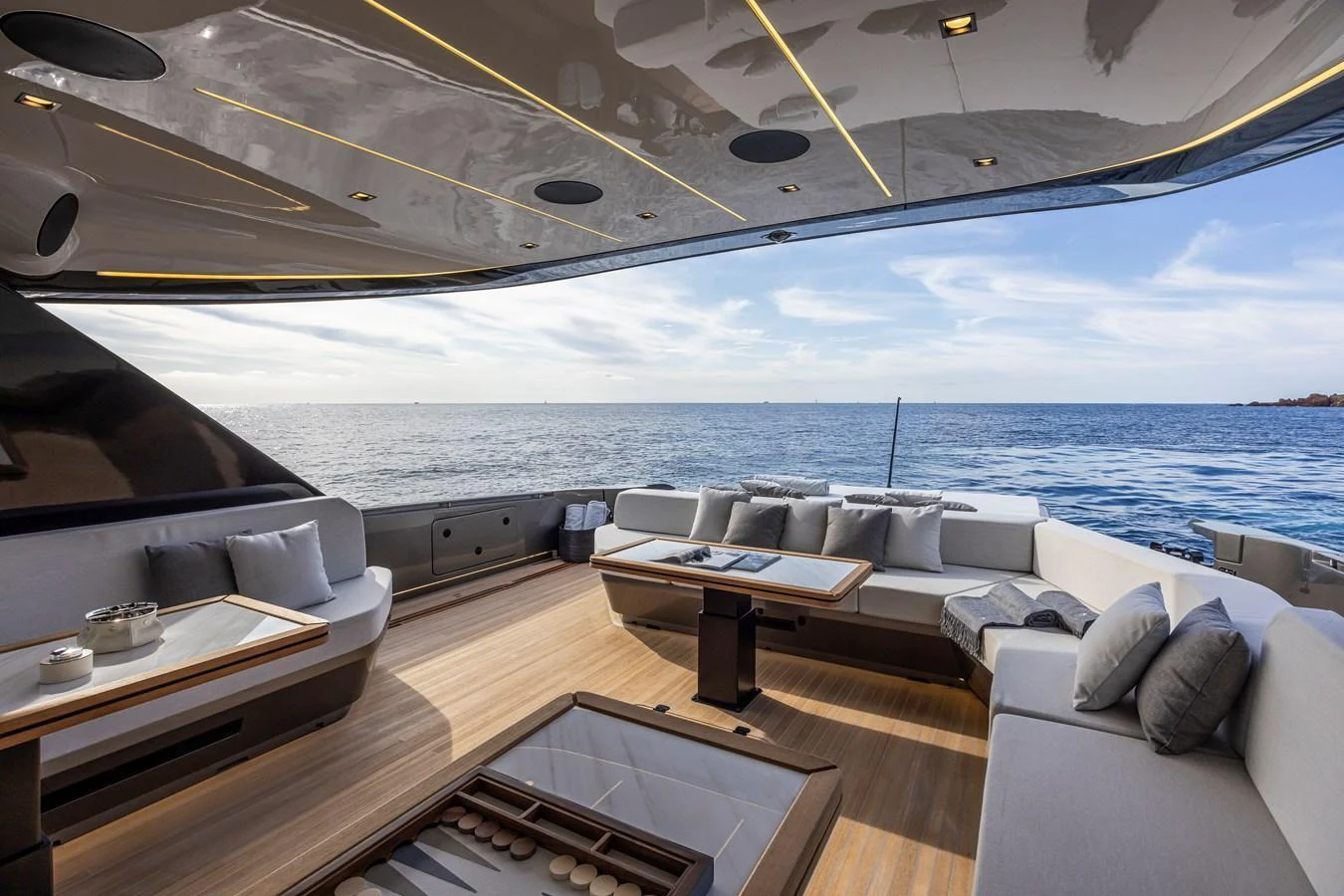The aft deck offers a luxurious outdoor lounging area with comfortable seating and stunning ocean views. aboard SEXY ME Yacht for Sale