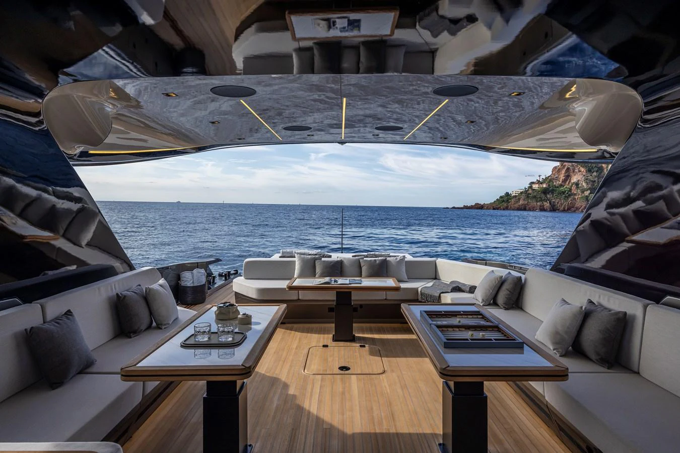 The aft deck offers a luxurious outdoor seating area with stunning ocean views. aboard SEXY ME Yacht for Sale