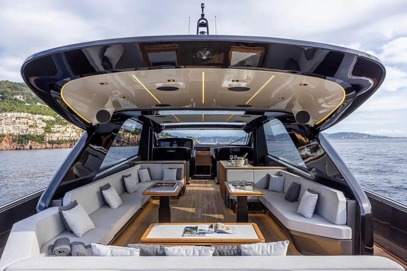 The yacht's aft deck features a spacious and luxurious seating area with ample shade and stunning views. aboard SEXY ME Yacht for Sale