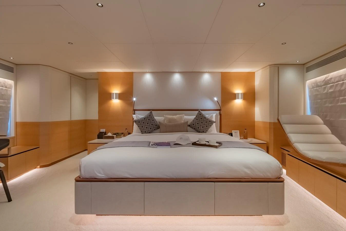 The master stateroom offers a spacious and luxurious retreat with elegant lighting and modern furnishings. aboard AVELINE Yacht for Sale