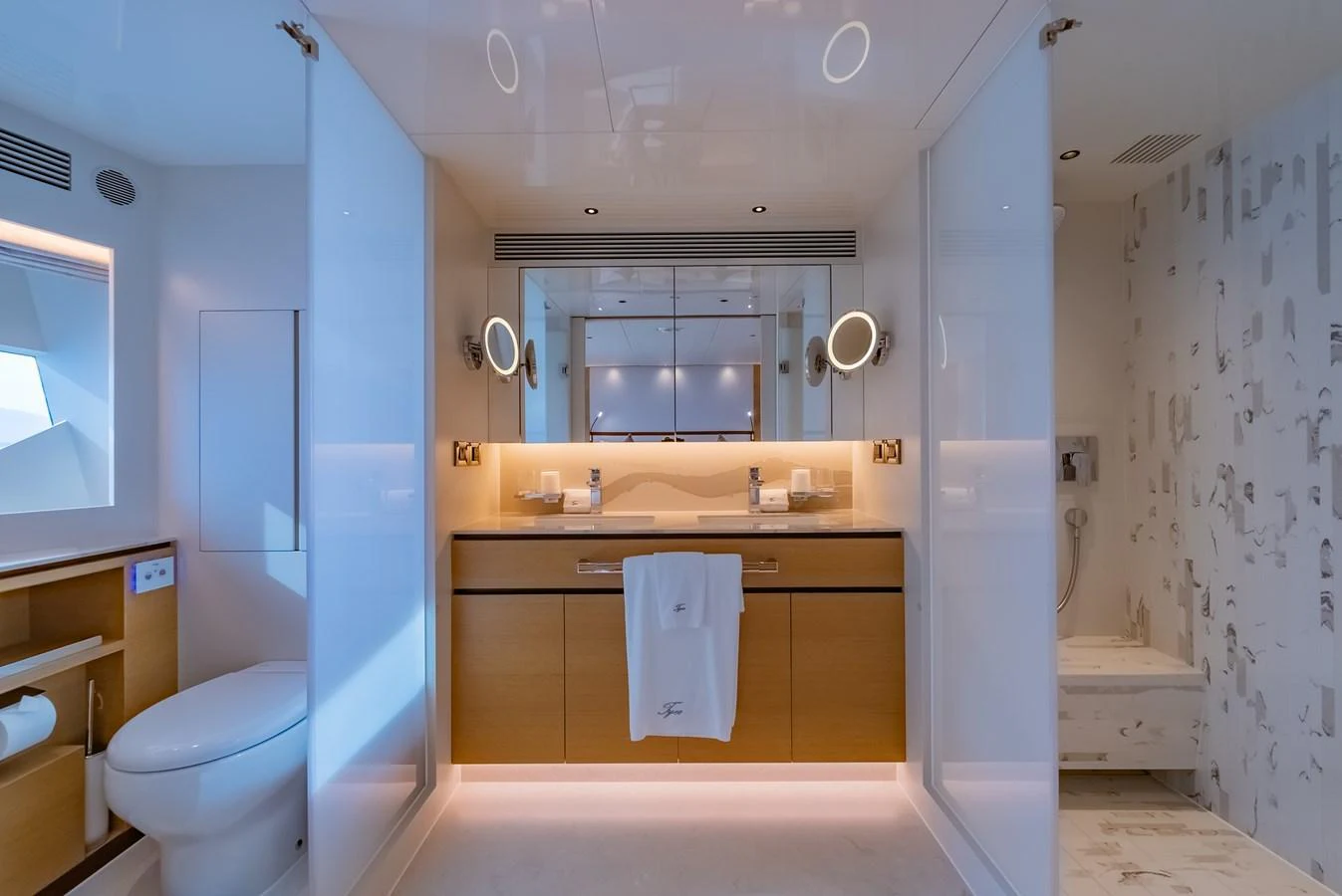 A luxurious yacht bathroom featuring modern fixtures and elegant lighting. aboard AVELINE Yacht for Sale