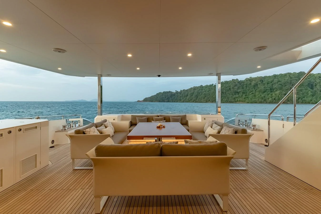 The aft deck features a spacious and comfortable seating area with a stunning view of the water. aboard AVELINE Yacht for Sale