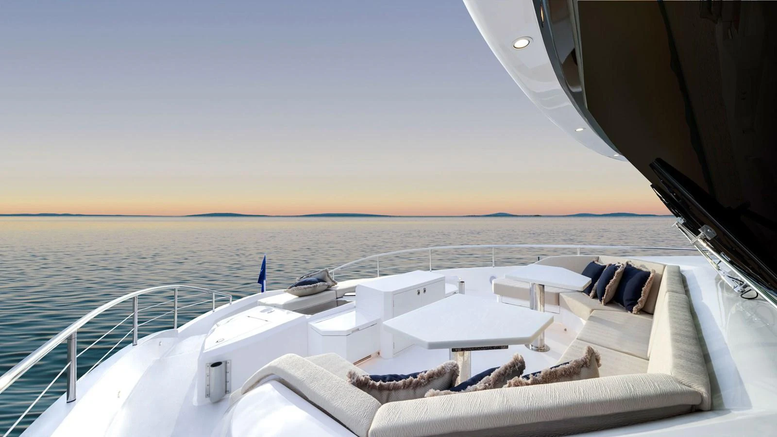 The yacht's sundeck offers a luxurious lounging area with stunning ocean views. aboard AQUA LIFE Yacht for Sale