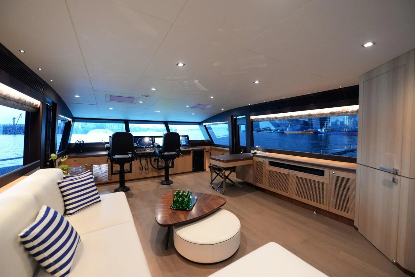 The salon offers a spacious and modern interior with panoramic views and stylish furnishings. aboard AQUA LIFE Yacht for Sale