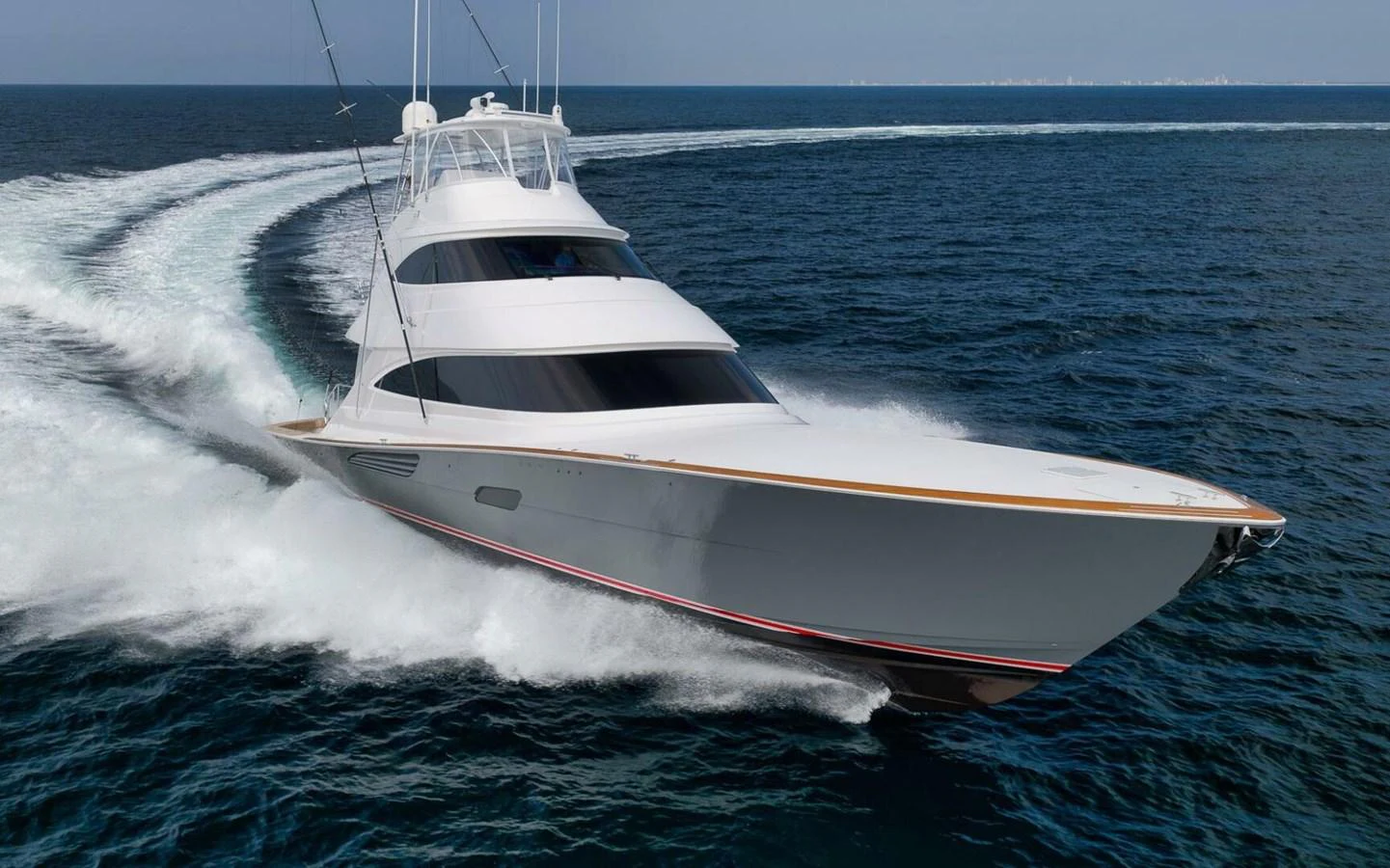 A sleek yacht cuts through the water with impressive speed and elegance. aboard NIKKI BELLA Yacht for Sale