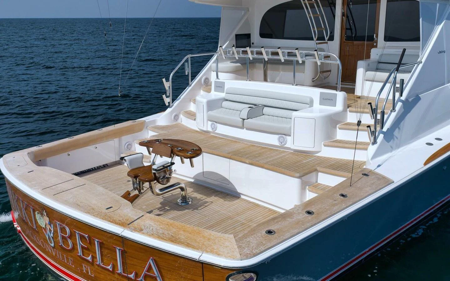 The spacious aft deck features comfortable seating and ample space for fishing or relaxing. aboard NIKKI BELLA Yacht for Sale