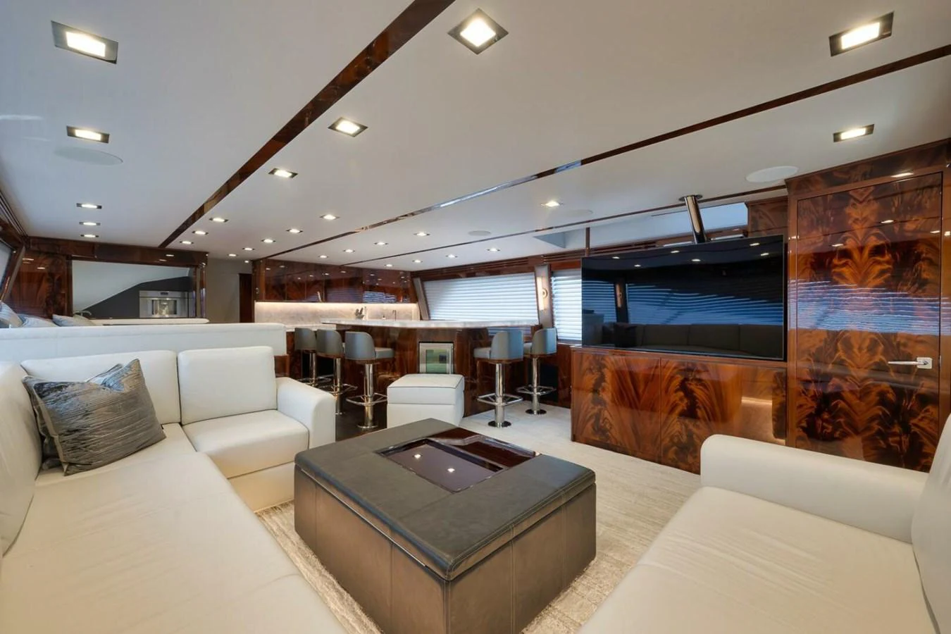 The salon features luxurious seating and elegant wood paneling, creating a sophisticated and comfortable atmosphere. aboard NIKKI BELLA Yacht for Sale