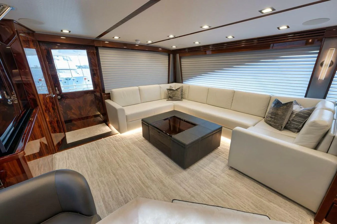The yacht's salon features a spacious and elegant seating area with plush furnishings and modern decor. aboard NIKKI BELLA Yacht for Sale