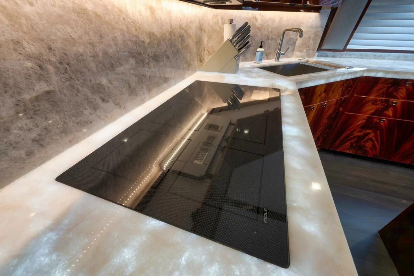 The yacht's galley features a sleek, modern design with high-end appliances and luxurious finishes. aboard NIKKI BELLA Yacht for Sale