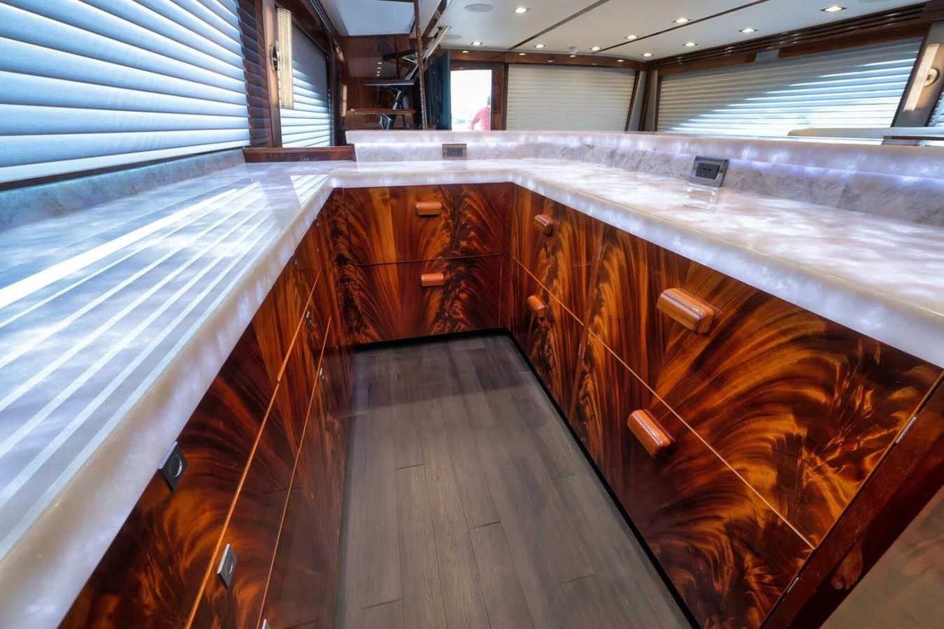 The galley features luxurious wood cabinetry and modern countertops, creating an elegant and functional space. aboard NIKKI BELLA Yacht for Sale