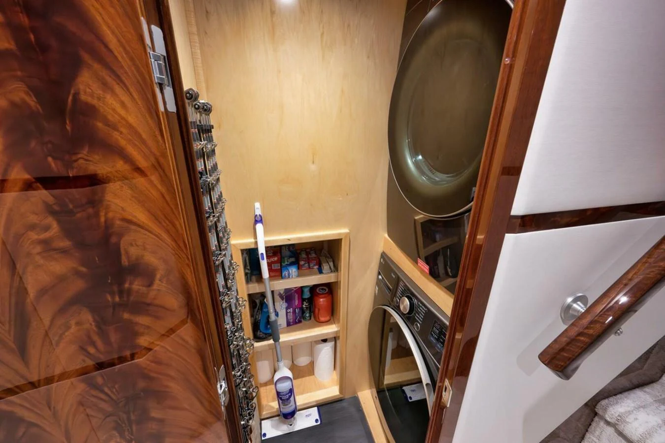 The yacht features a compact and well-organized laundry room with modern appliances. aboard NIKKI BELLA Yacht for Sale