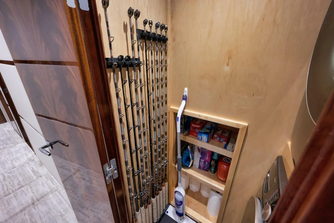 A well-organized storage area for fishing rods and supplies on the yacht. aboard NIKKI BELLA Yacht for Sale