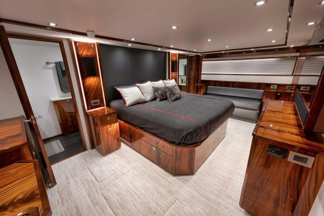 The master stateroom features luxurious wood finishes and a spacious bed for ultimate comfort. aboard NIKKI BELLA Yacht for Sale