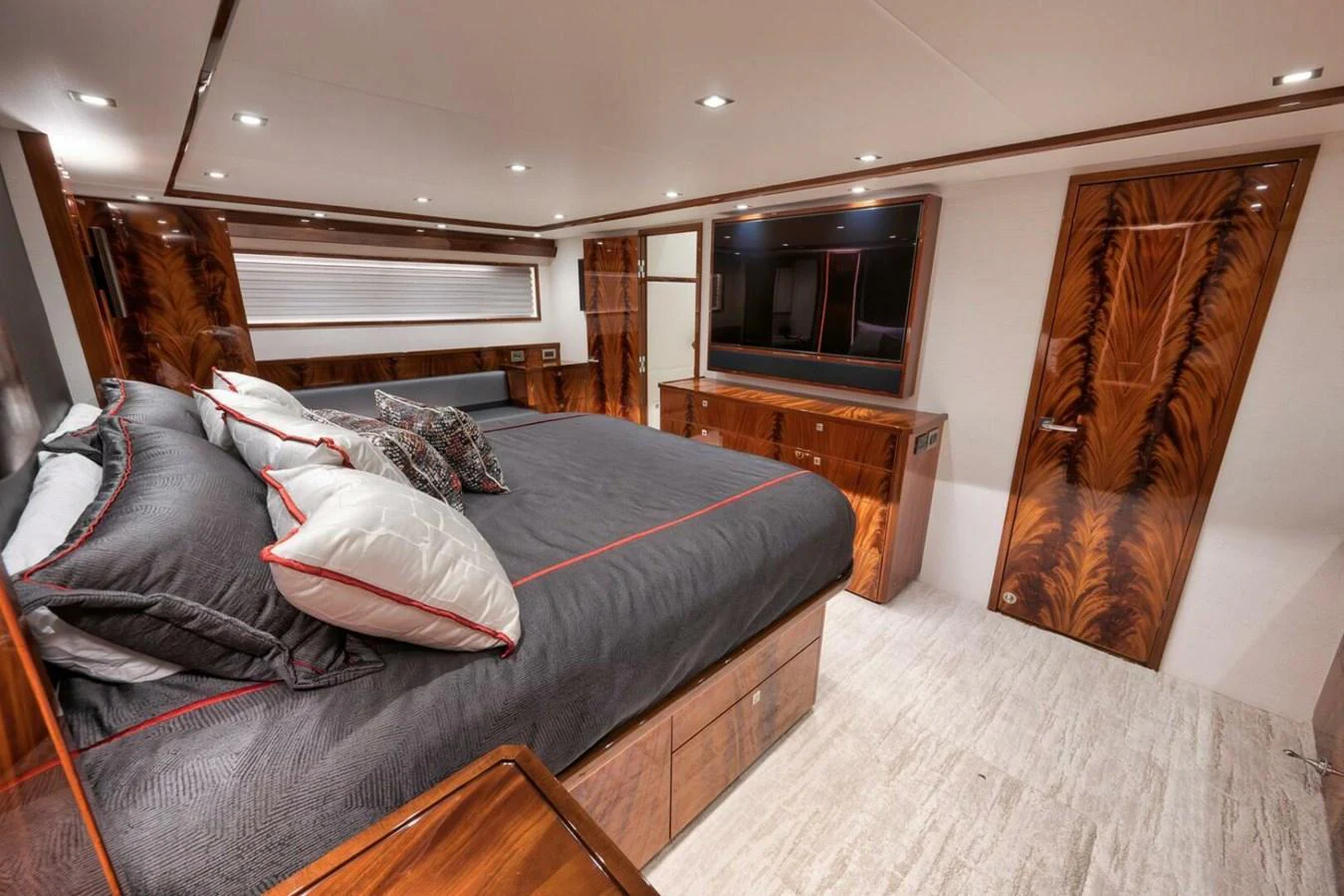 The master stateroom features luxurious wood finishes and a spacious, comfortable bed. aboard NIKKI BELLA Yacht for Sale