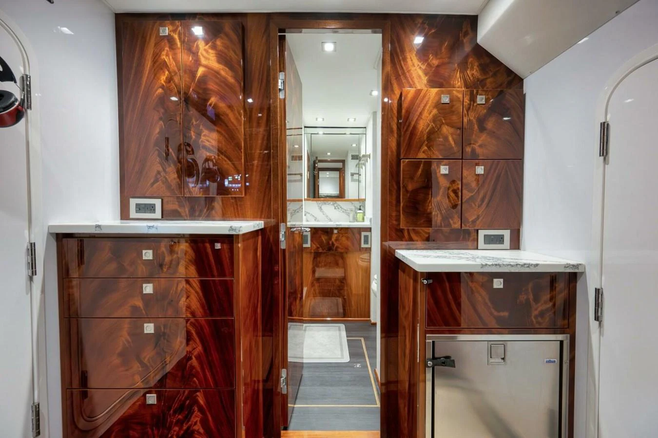 The yacht's galley features rich wood cabinetry and modern appliances, creating a luxurious and functional space. aboard NIKKI BELLA Yacht for Sale
