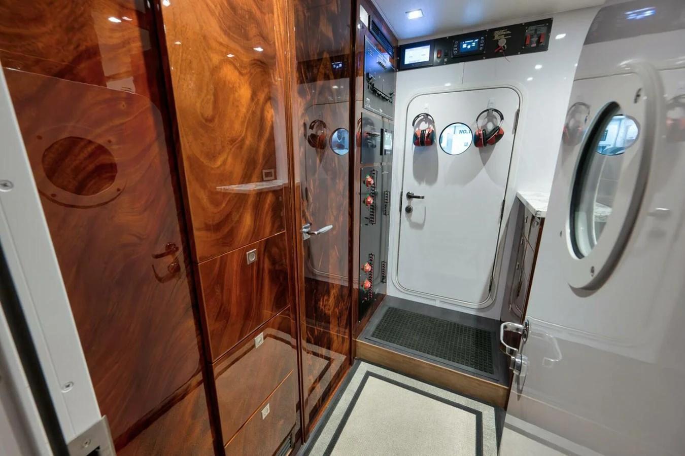 A luxurious yacht interior featuring a combination of wood paneling and modern fixtures. aboard NIKKI BELLA Yacht for Sale