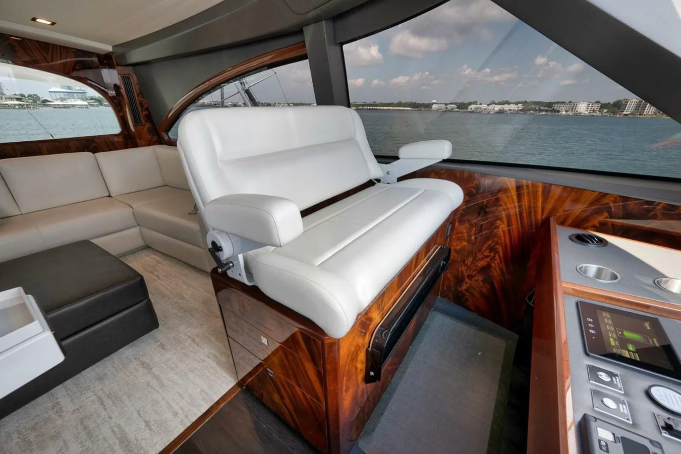 The helm area features luxurious seating with a panoramic view of the water. aboard NIKKI BELLA Yacht for Sale