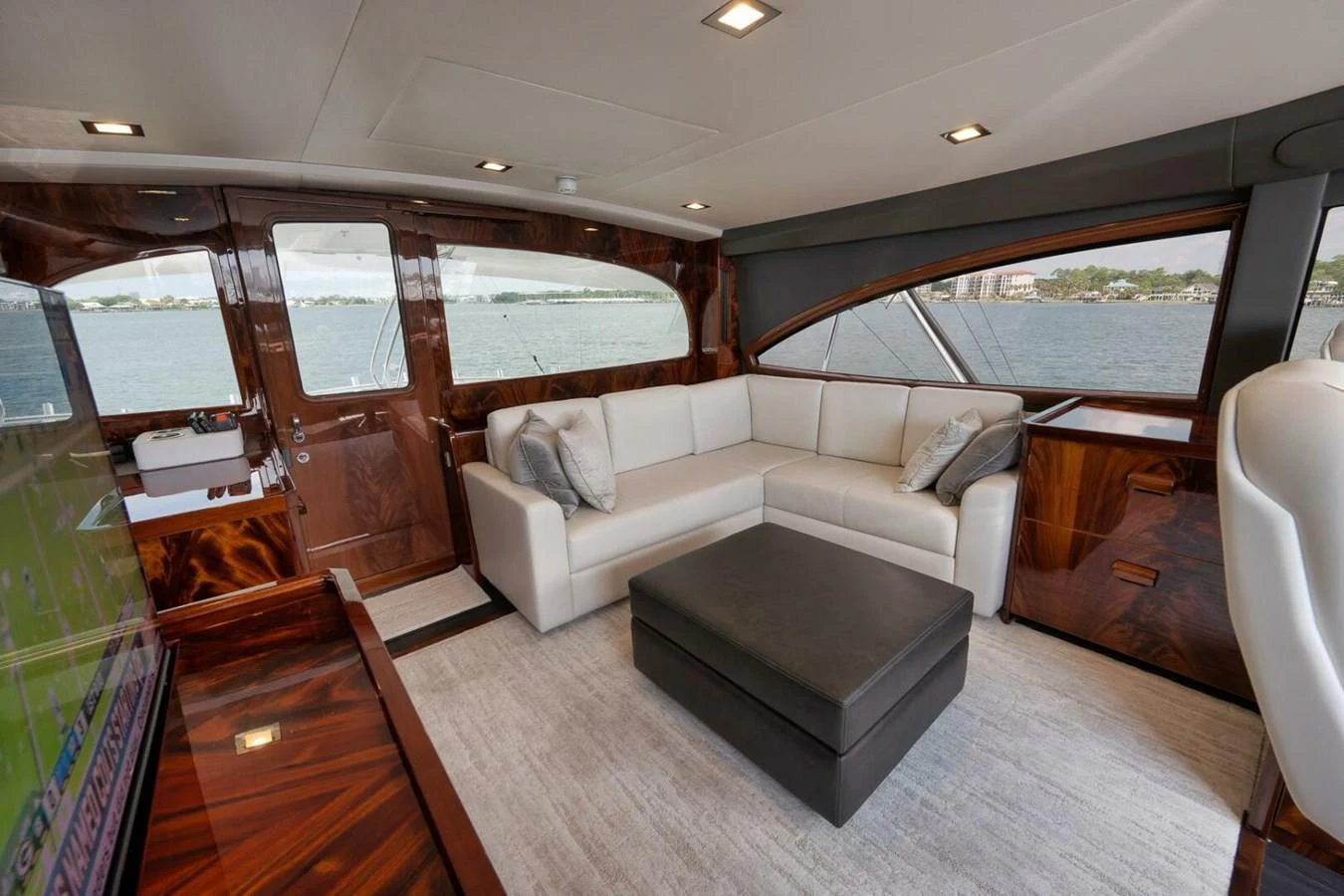 The yacht's salon offers a luxurious and comfortable seating area with panoramic views of the water. aboard NIKKI BELLA Yacht for Sale