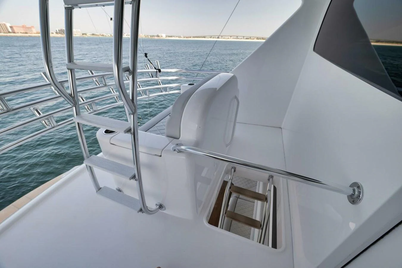 The flybridge offers a sleek and modern seating area with a clear view of the surrounding waters. aboard NIKKI BELLA Yacht for Sale