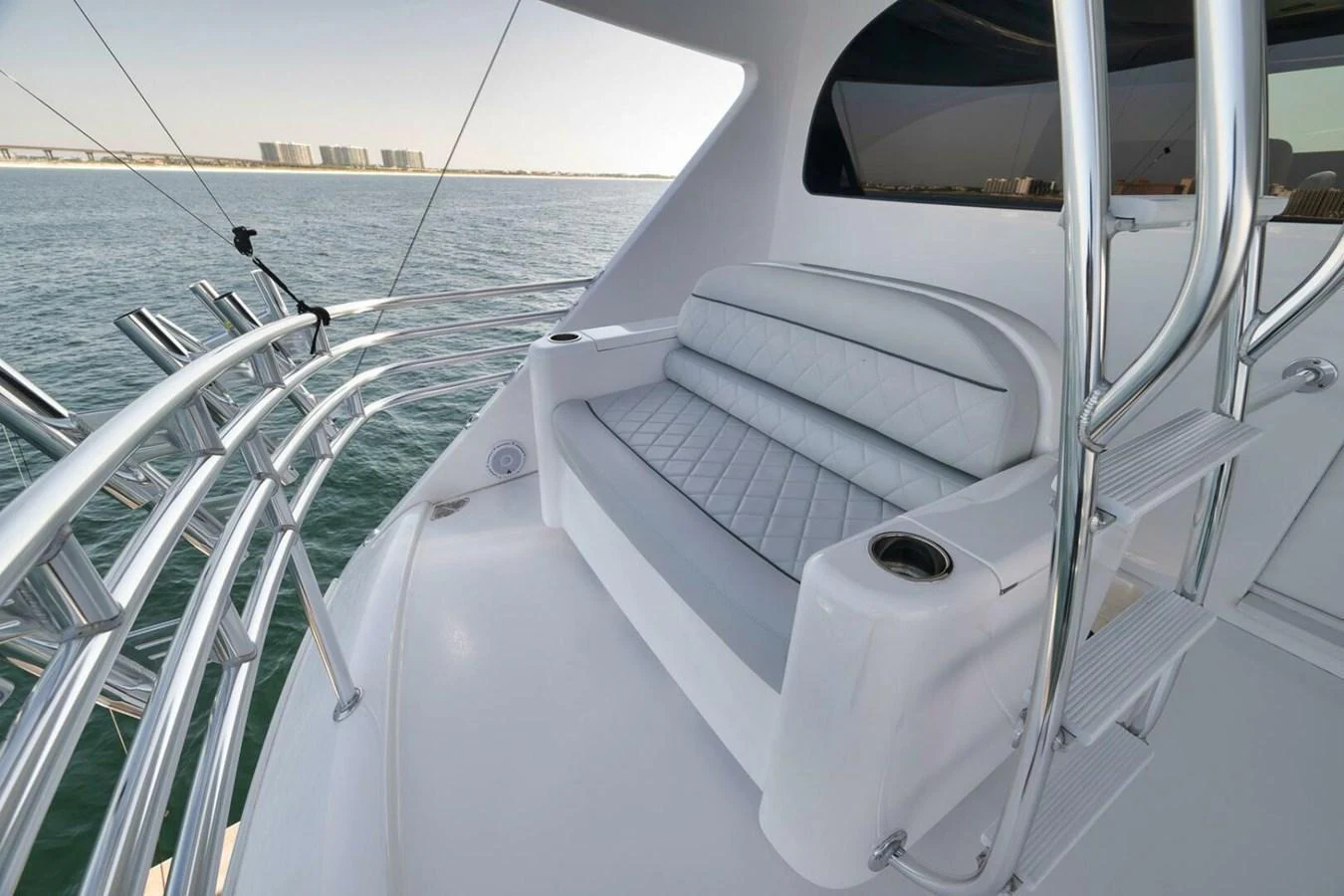The flybridge offers a comfortable seating area with a scenic view of the water. aboard NIKKI BELLA Yacht for Sale