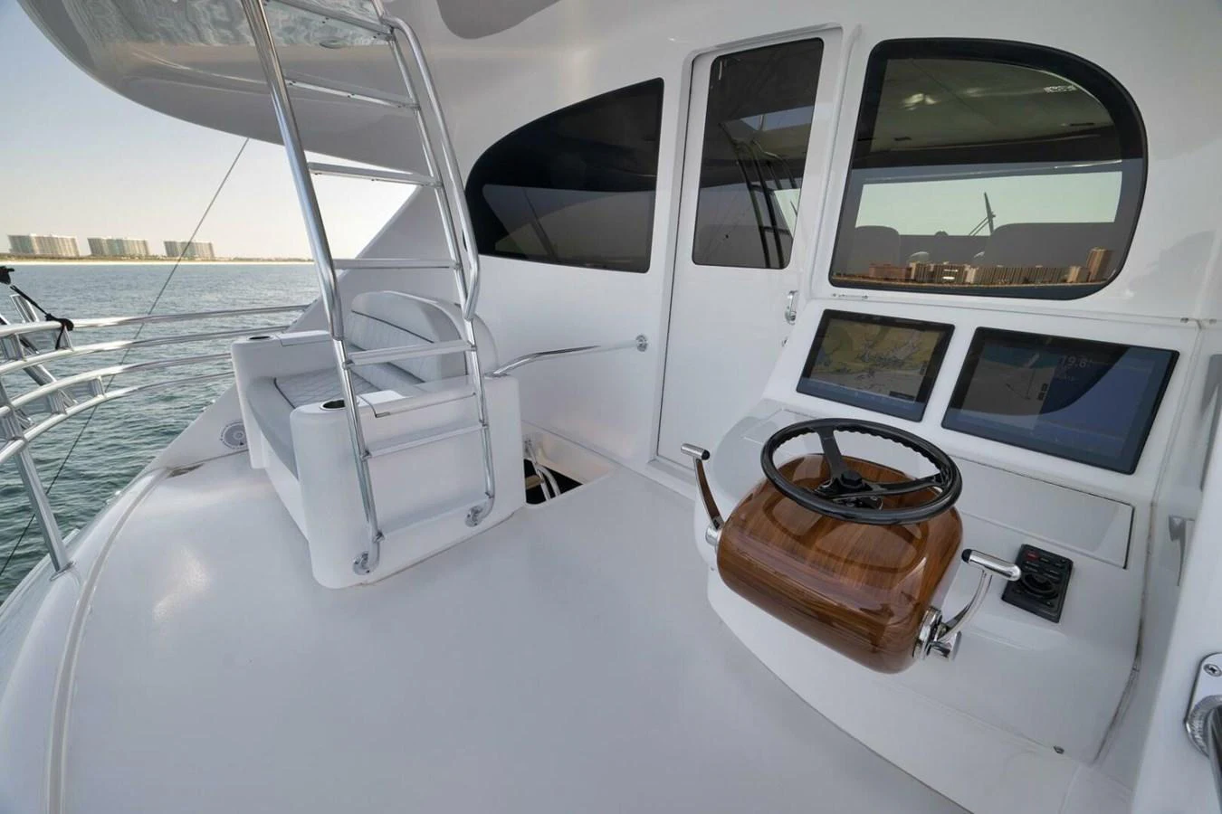 The yacht's helm features a sleek design with modern navigation equipment and a comfortable steering station. aboard NIKKI BELLA Yacht for Sale