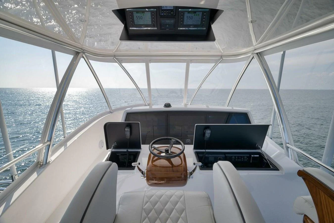 The helm station offers a commanding view of the open sea with state-of-the-art navigation equipment. aboard NIKKI BELLA Yacht for Sale