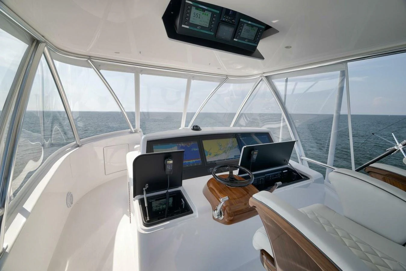 The helm station offers a commanding view of the open sea with advanced navigation equipment. aboard NIKKI BELLA Yacht for Sale
