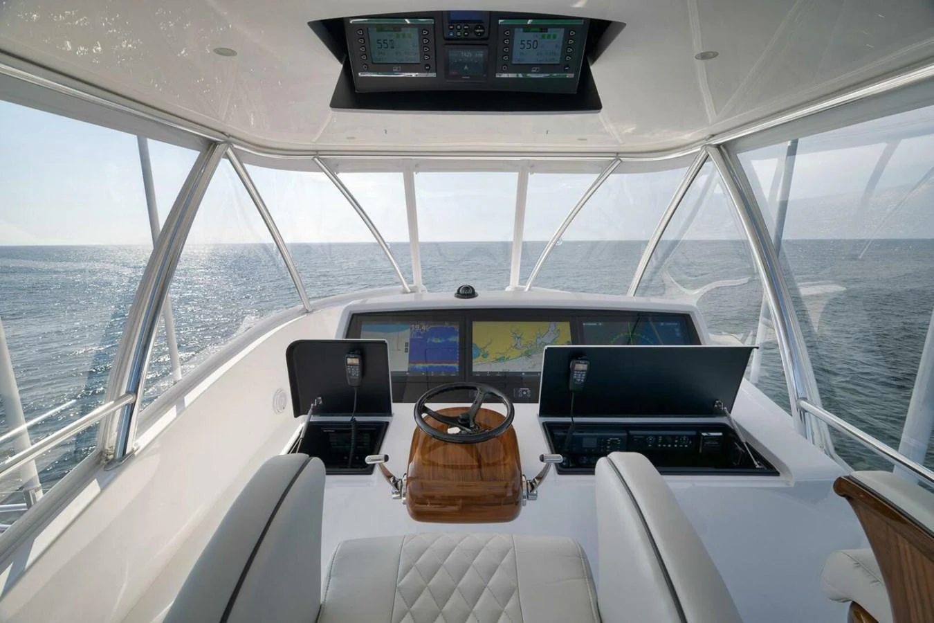 The helm station offers a commanding view with state-of-the-art navigation equipment and luxurious seating. aboard NIKKI BELLA Yacht for Sale