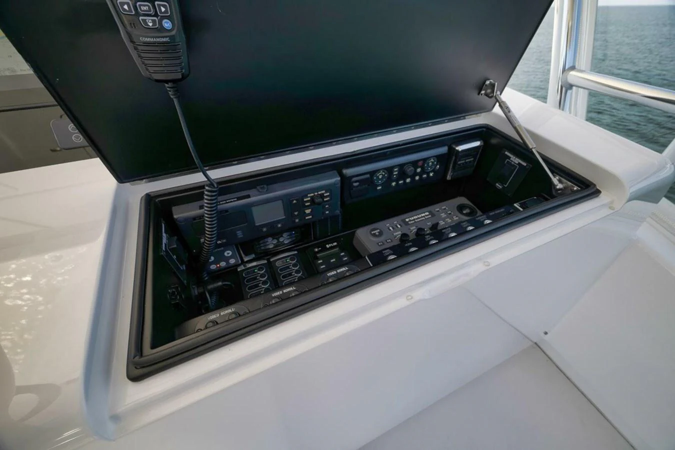 The image showcases a detailed view of the yacht's helm electronics and communication equipment. aboard NIKKI BELLA Yacht for Sale