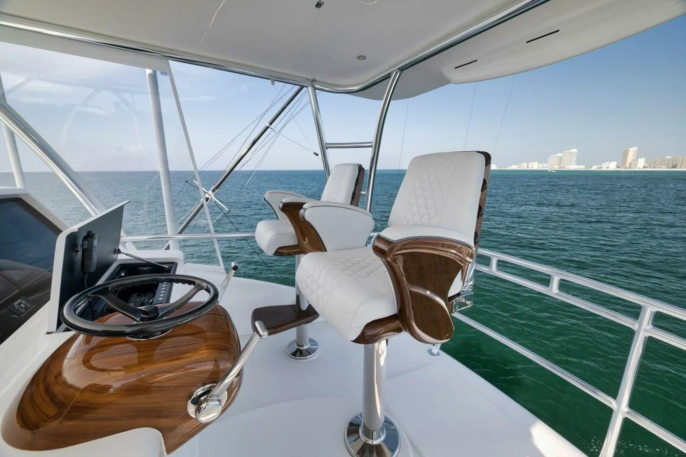 The helm features luxurious seating with a stunning ocean view. aboard NIKKI BELLA Yacht for Sale
