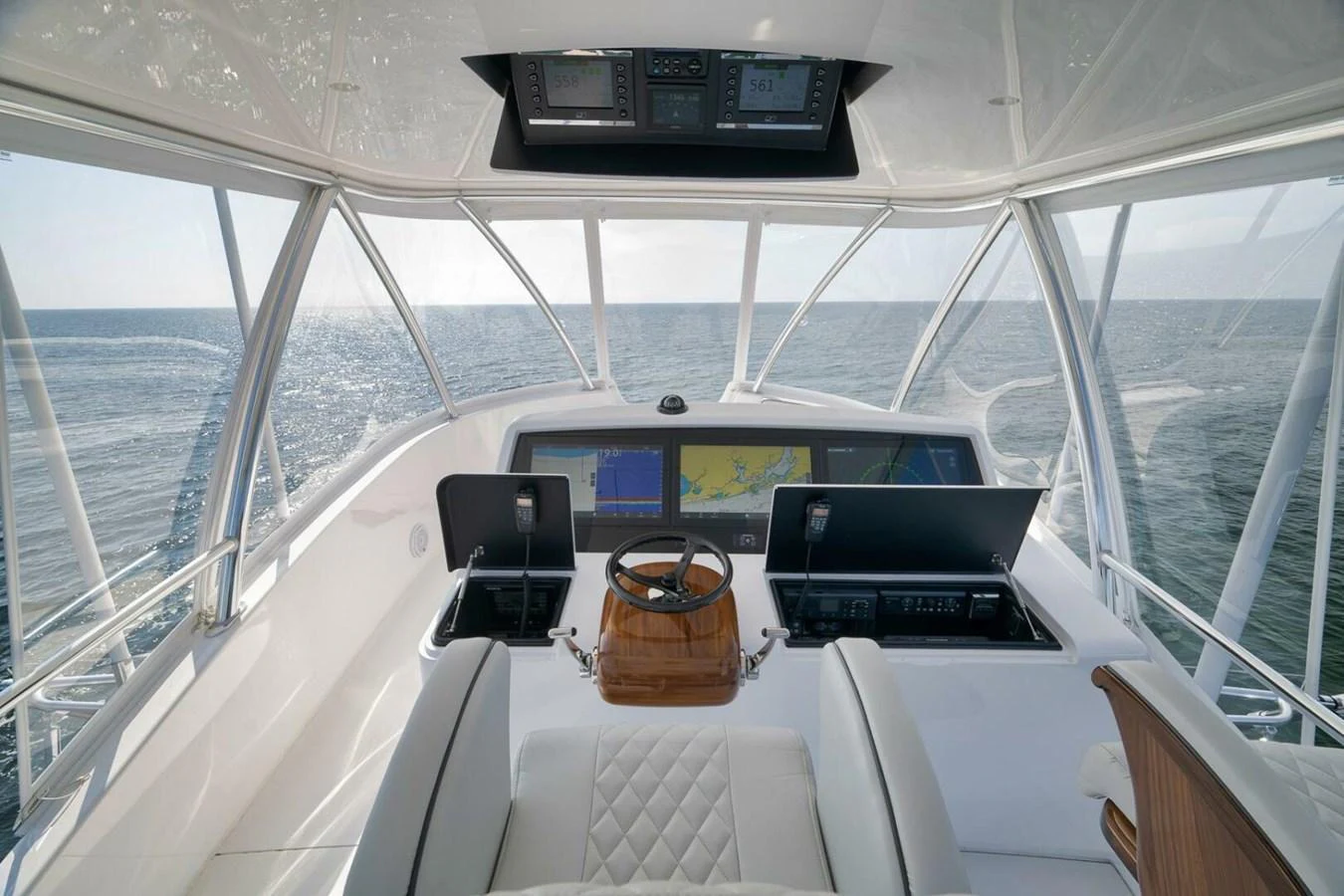 The helm station offers a commanding view of the open sea with state-of-the-art navigation equipment. aboard NIKKI BELLA Yacht for Sale