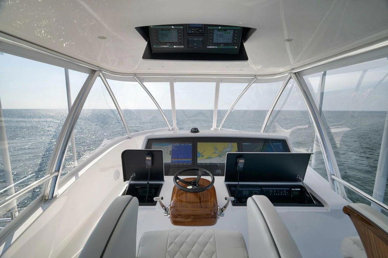 The helm station offers a commanding view of the open sea with state-of-the-art navigation equipment. aboard NIKKI BELLA Yacht for Sale