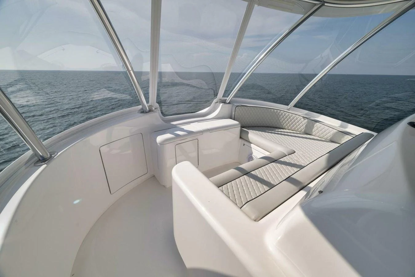 The flybridge offers a serene space with panoramic ocean views and comfortable seating. aboard NIKKI BELLA Yacht for Sale