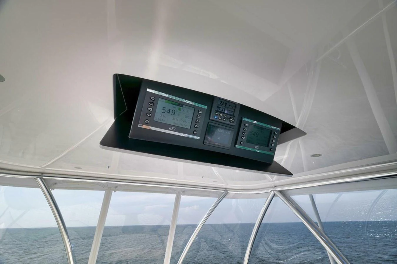 The yacht's helm features advanced navigation instruments set against a sleek, modern design. aboard NIKKI BELLA Yacht for Sale