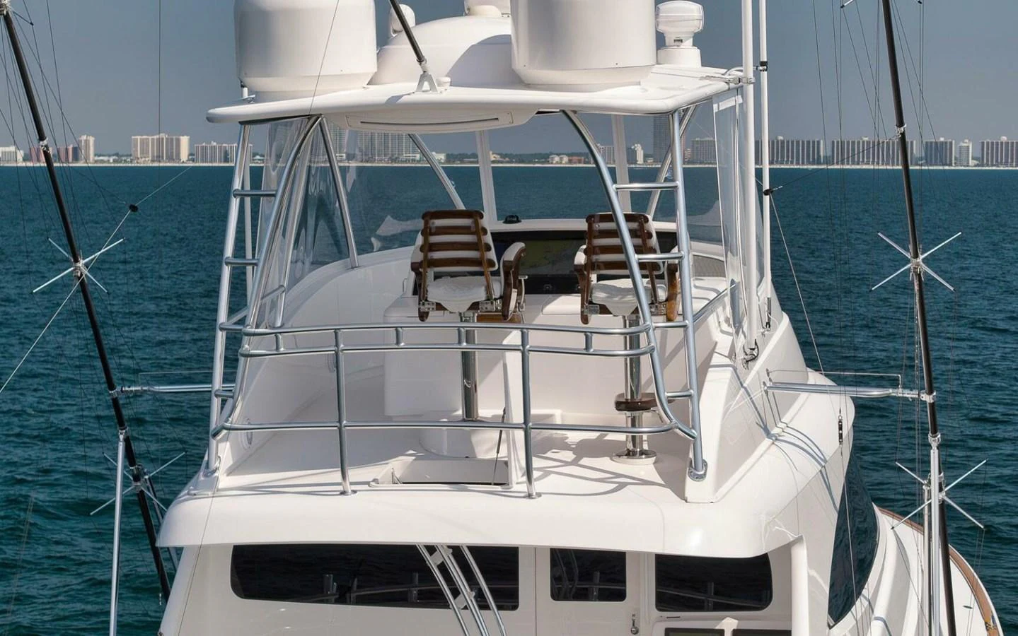 The yacht features a spacious flybridge with comfortable seating and panoramic views. aboard NIKKI BELLA Yacht for Sale