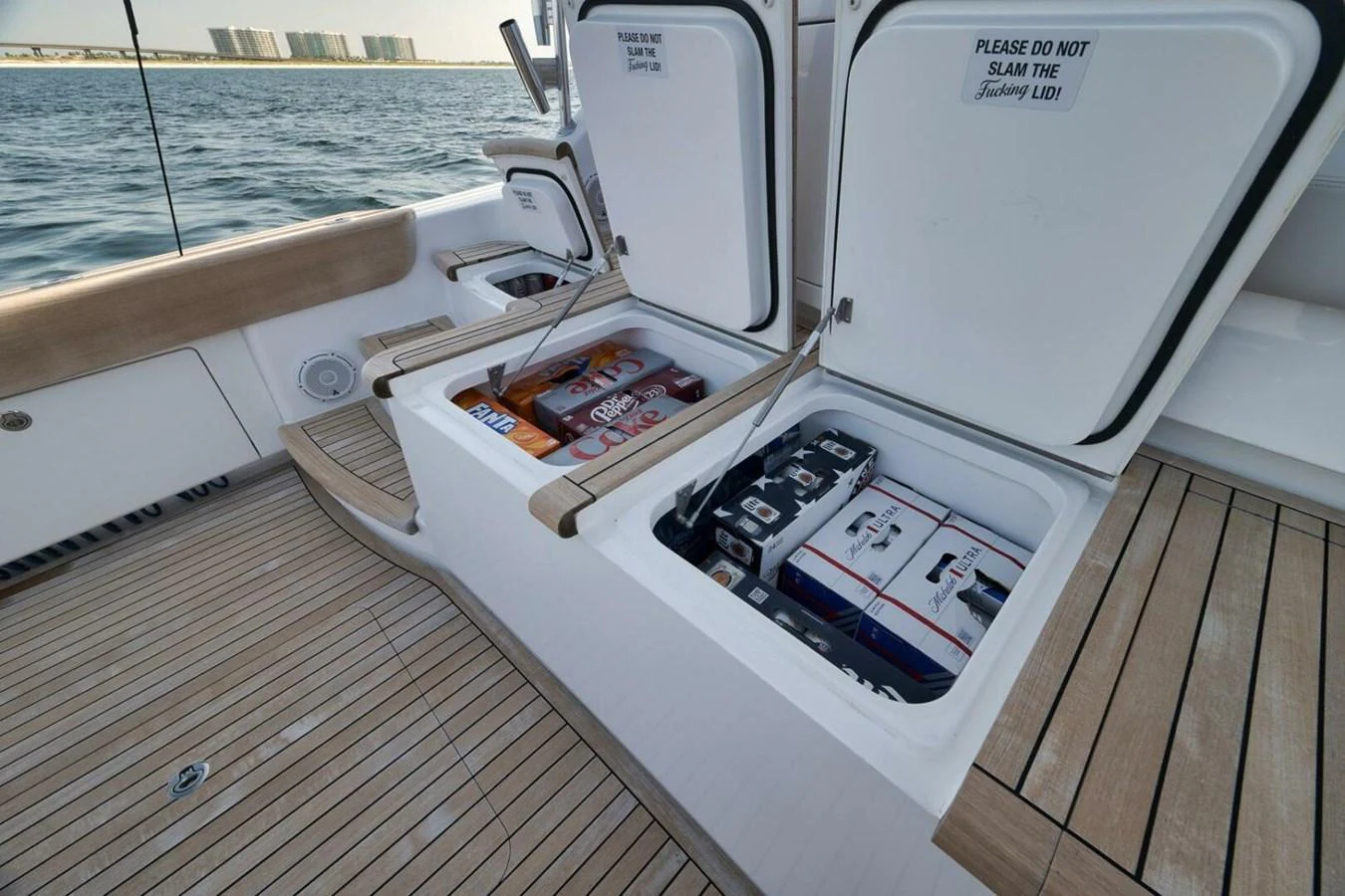 The image showcases the storage compartments on the yacht's deck, filled with beverages and snacks. aboard NIKKI BELLA Yacht for Sale