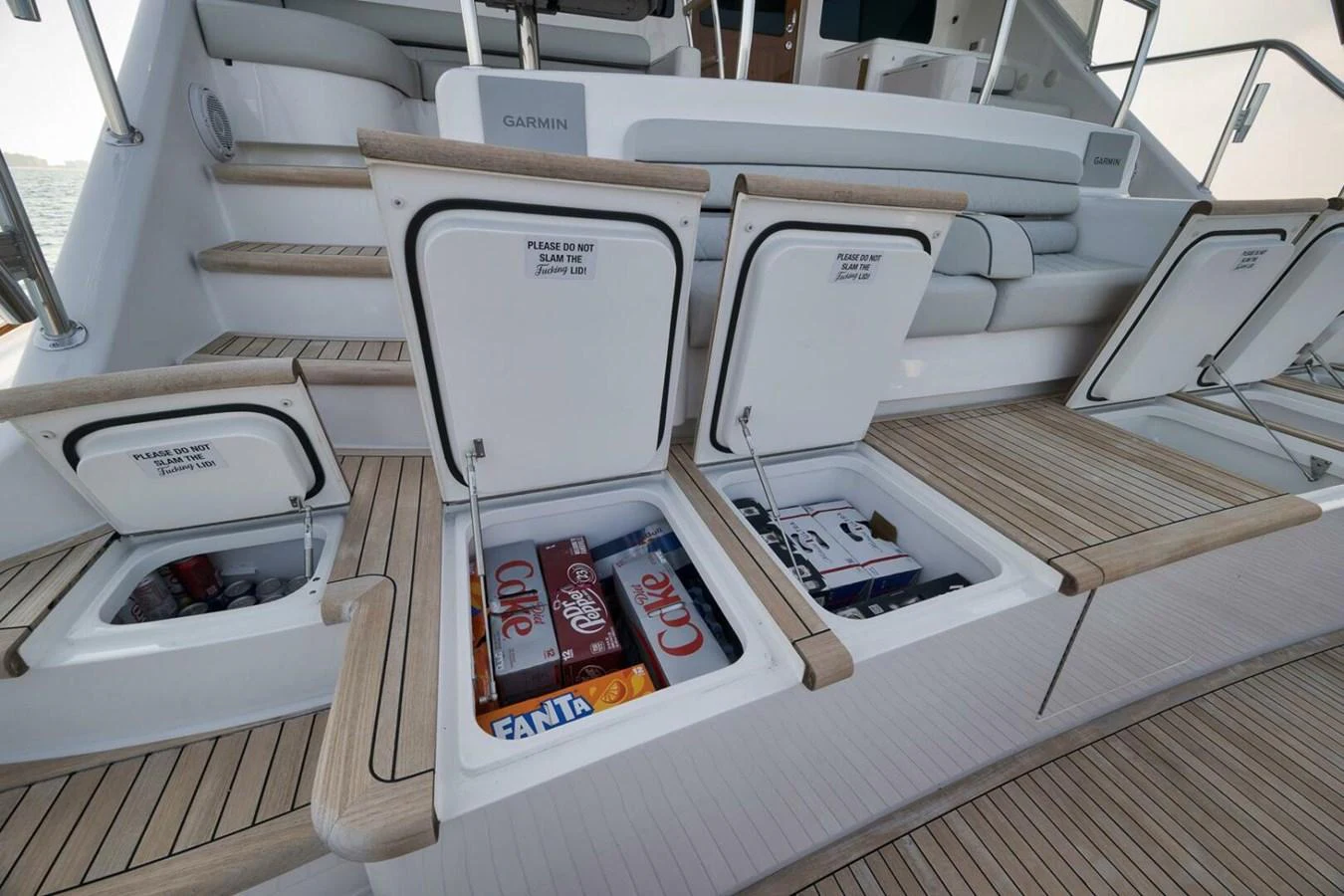 The image showcases the yacht's convenient storage compartments filled with beverages. aboard NIKKI BELLA Yacht for Sale